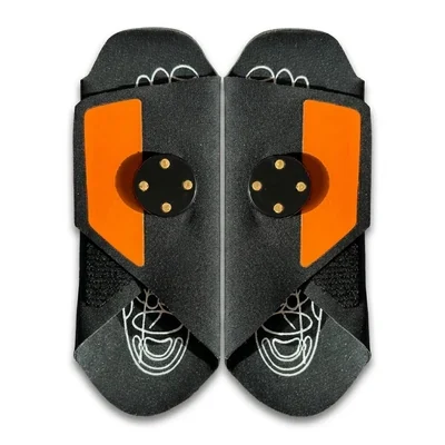 Pair of Stepeva EMS slippers seen from above, black soles with orange conductive inserts